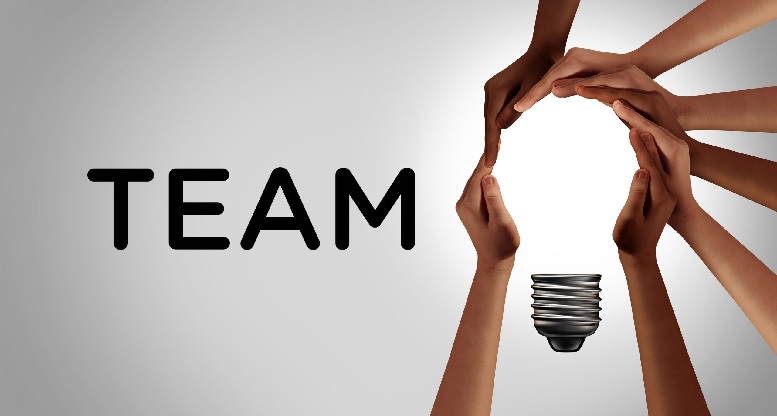 The word team with hands holding a lightbulb
